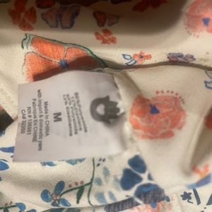 Spiritual gangster sports bra or bathing suit top.